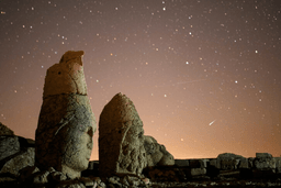 Ancient statues are seen during the Perseid meteor shower atop Mount Nemrut in southeastern Turkey, Sunday, Aug.11, 2024. (AP Photo/Emrah Gurel,File)