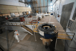 Workers package reactor components on the reactor operating floor of the former nuclear power plant of Latina, Italy, Thursday, June 18, 2026. (AP Photo/Alessandra Tarantino)