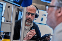 Options traders Steven Rodriguez, left, and Marty Handler work on the floor of the New York Stock Exchange, Wednesday, June 3, 2026. (AP Photo/Richard Drew)