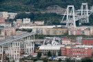 Cars are blocked on the Morandi highway bridge after a section of it collapsed, Aug. 14, 2018, in Genoa, northern Italy. (AP Photo/Antonio Calanni, File)