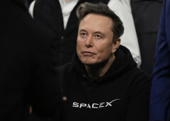 Elon Musk attends the finals for the NCAA wrestling championship, March 22, 2025, in Philadelphia. (AP Photo/Matt Rourke, File)