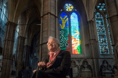 British artist David Hockney sits in front of The Queen's Window, a new stained glass window at Westminster Abbey, London, designed by David Hockney and revealed for the first time on Wednesday Sept. 26, 2018. (Victoria Jones/Pool via AP, File)