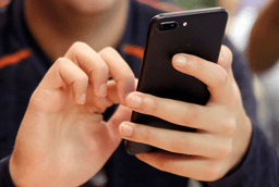 A person uses a smart phone in Chicago, Sept. 16, 2017. (AP Photo, File)